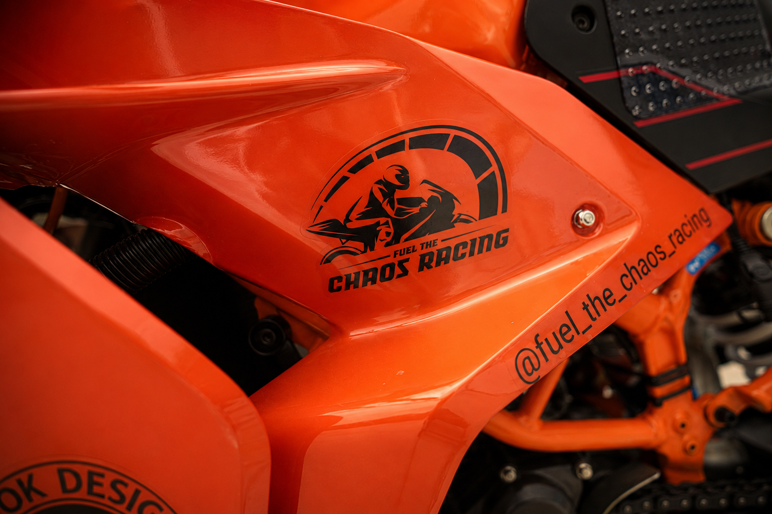 Fuel the Chaos Racing logo decal on the orange bodywork